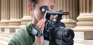Man operating Blackmagic Design PYXIS camera fitted with Pro Handle and Pro Grip