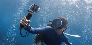 Insta360 Ace Pro 2 held underwater by free diver