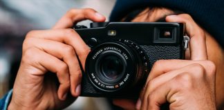 Fujifilm camera being held by a person