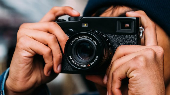 Fujifilm camera being held by a person