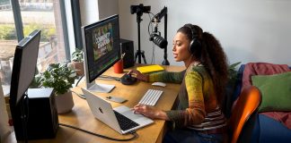 A lifestyle photo shows a person working with the new 14-inch MacBook Pro, an external display, and recording equipment.